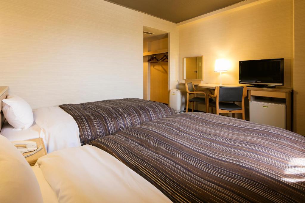 Postel nebo postele na pokoji v ubytování Ark Hotel Okayama -ROUTE INN HOTELS-