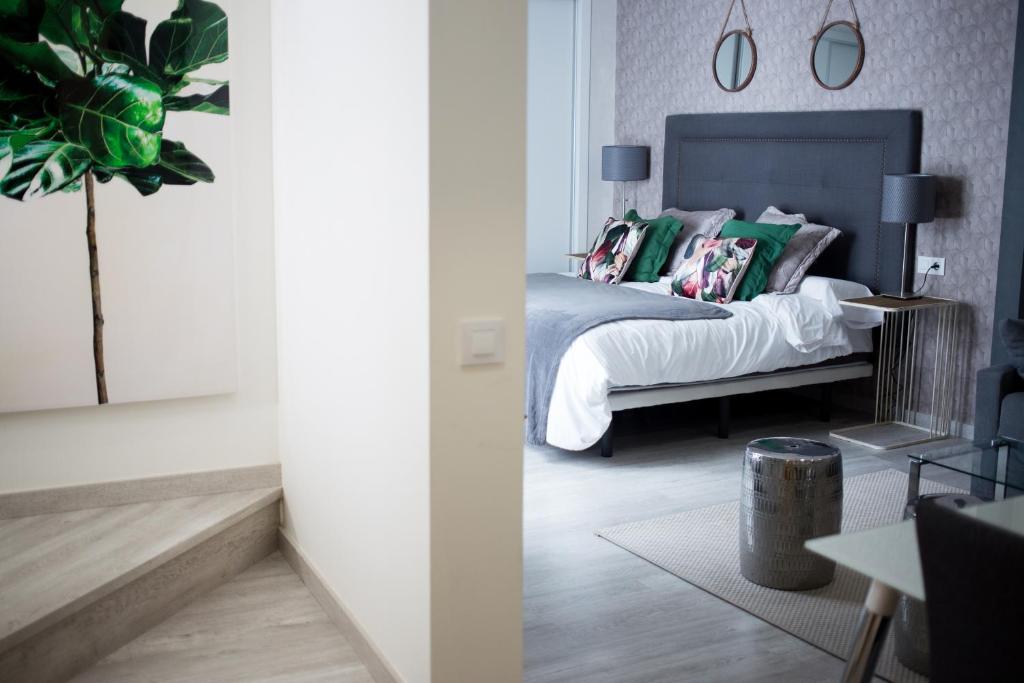 Posteľ alebo postele v izbe v ubytovaní Apartamentos Soho Boutique Museo