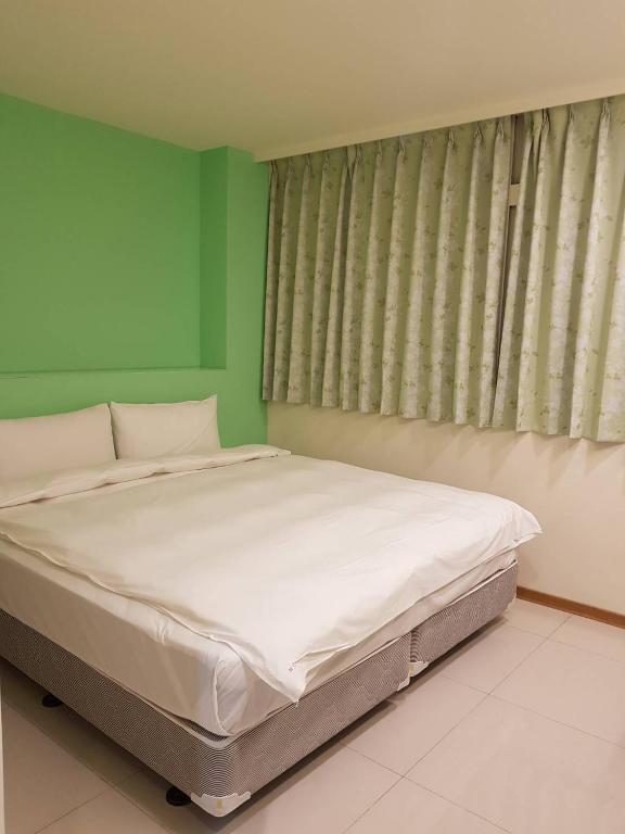 Postel nebo postele na pokoji v ubytování Galaxy Mini Inn