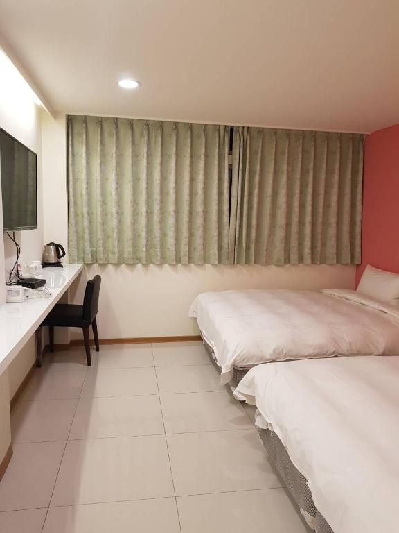 Postel nebo postele na pokoji v ubytování Galaxy Mini Inn