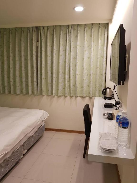 Postel nebo postele na pokoji v ubytování Galaxy Mini Inn