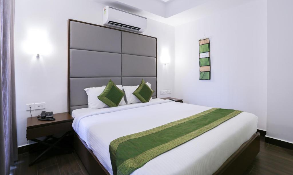 Postel nebo postele na pokoji v ubytování Hotel Crown Suites