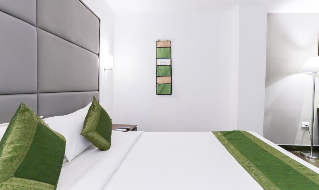 Postel nebo postele na pokoji v ubytování Hotel Crown Suites