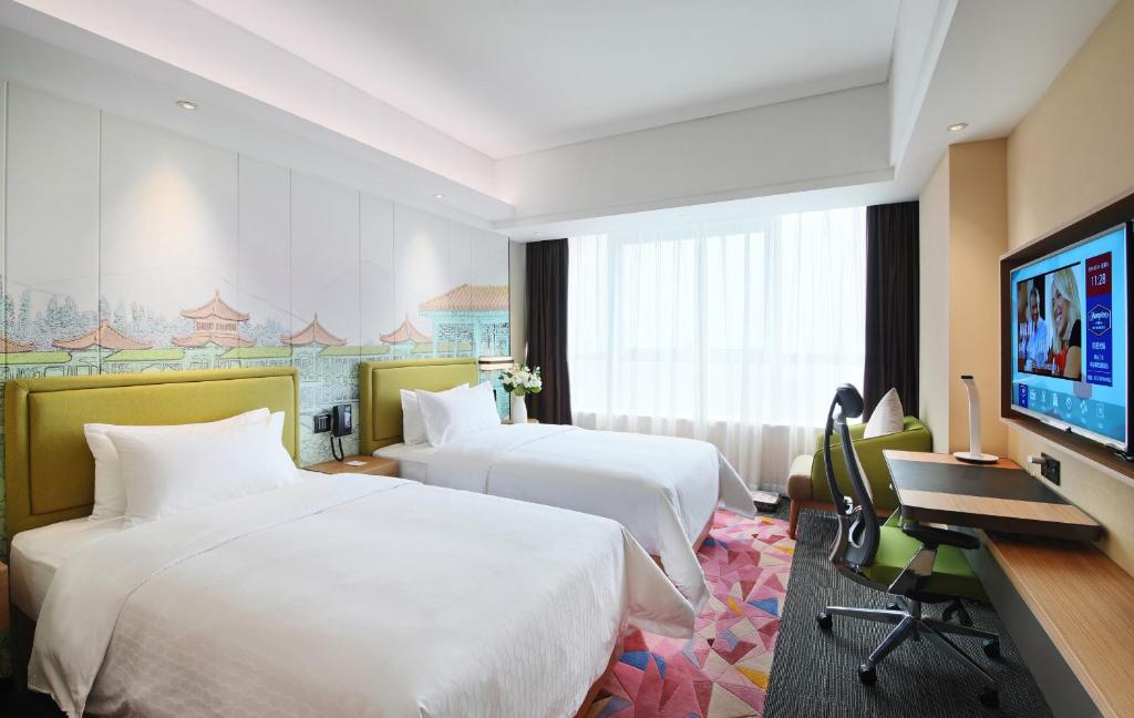 TV a/nebo společenská místnost v ubytování Hampton By Hilton Foshan Sanshui