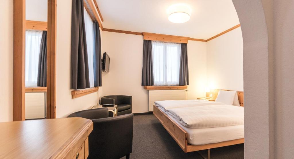 Postel nebo postele na pokoji v ubytování Hotel Alte Post by Mountain Hotels