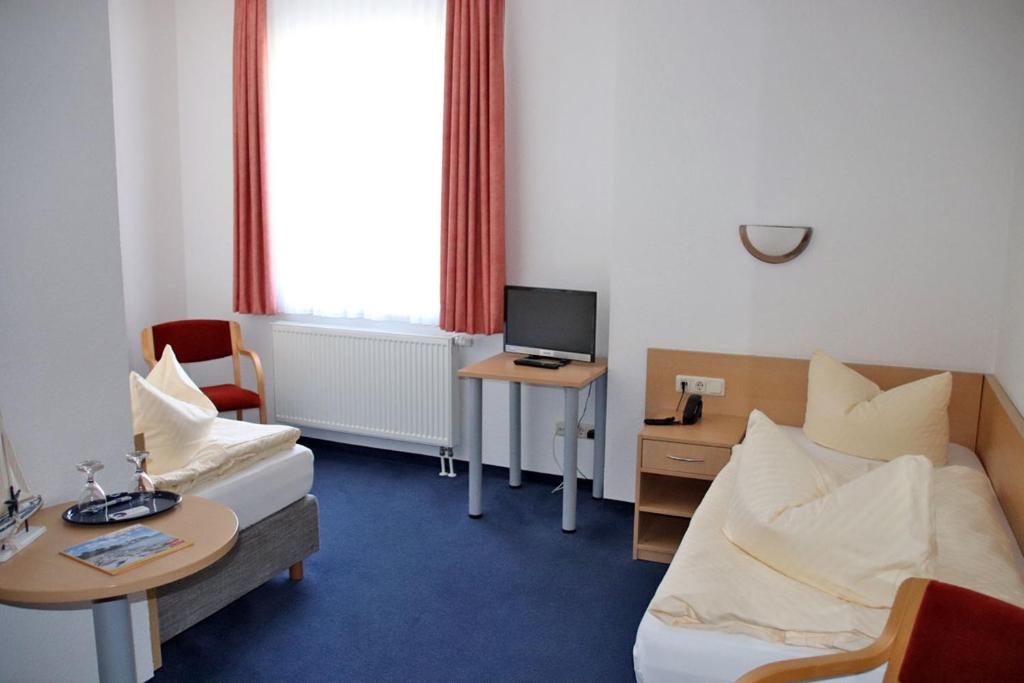 TV a/nebo společenská místnost v ubytování Hotel Garni Meeresgruß