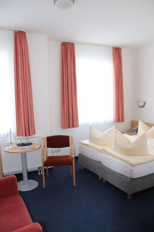 Postel nebo postele na pokoji v ubytování Hotel Garni Meeresgruß