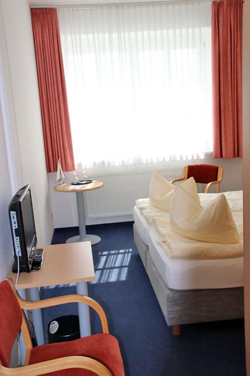 TV a/nebo společenská místnost v ubytování Hotel Garni Meeresgruß