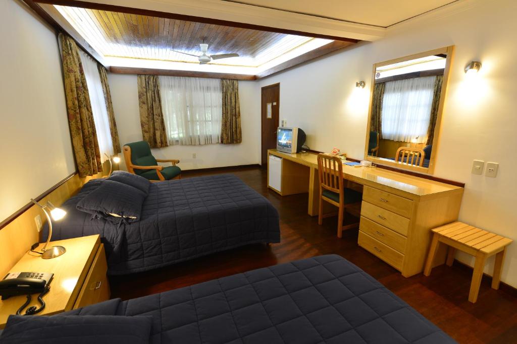 Letto o letti in una camera di Hotel Restaurant Papillon