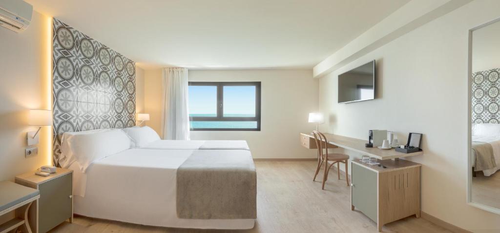 Postel nebo postele na pokoji v ubytování Gastrohotel Boutique RH Canfali