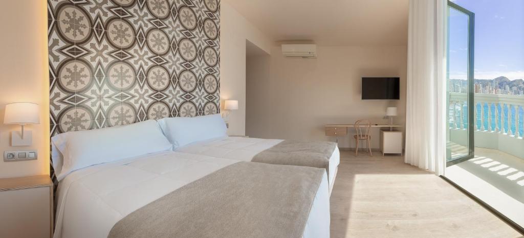 Postel nebo postele na pokoji v ubytování Gastrohotel Boutique RH Canfali