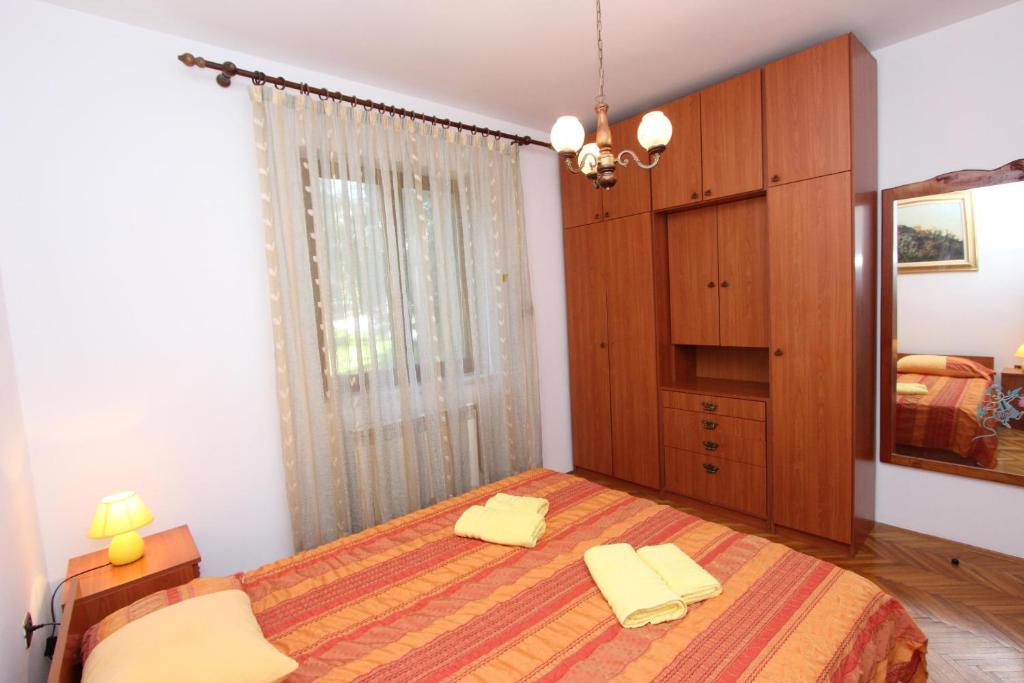 Łóżko lub łóżka w pokoju w obiekcie Apartment Clementina