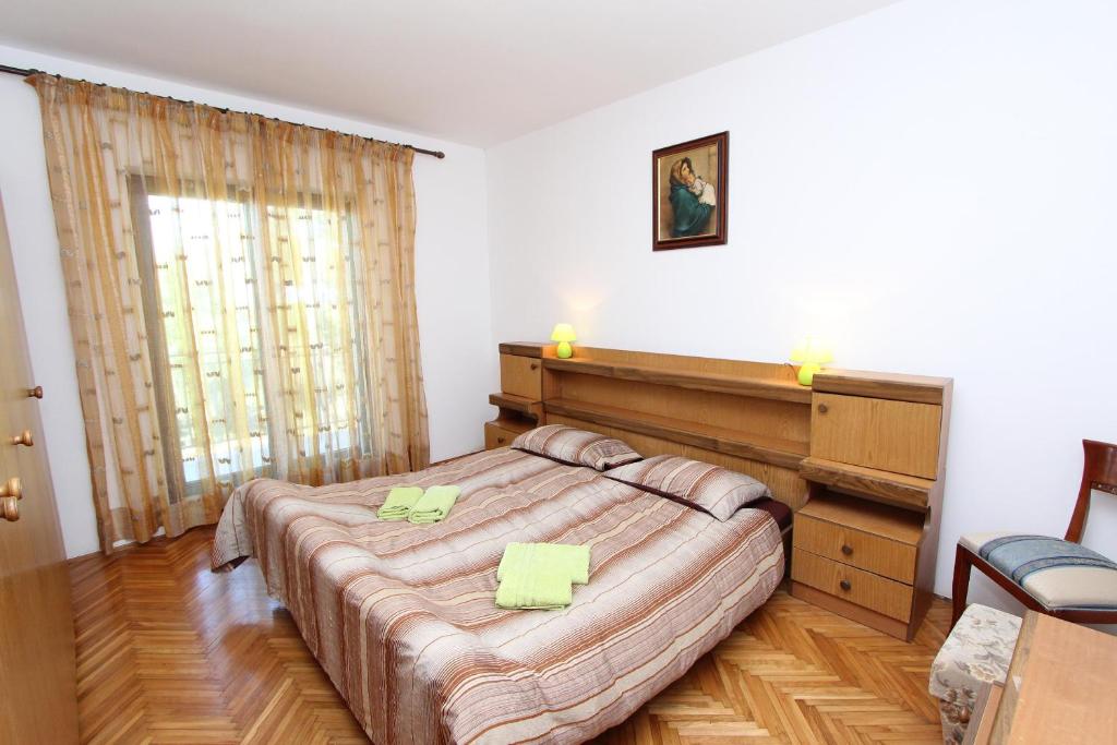 Łóżko lub łóżka w pokoju w obiekcie Apartment Clementina