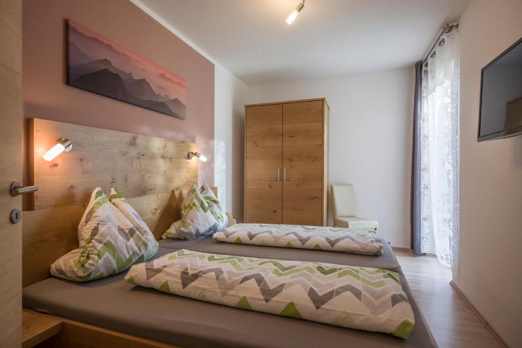 Posteľ alebo postele v izbe v ubytovaní Haus Natalie