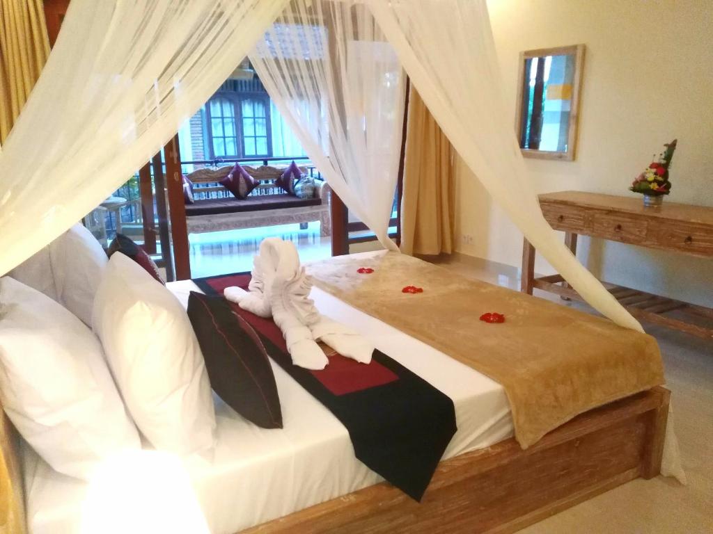 Postel nebo postele na pokoji v ubytování Qiul Guest House
