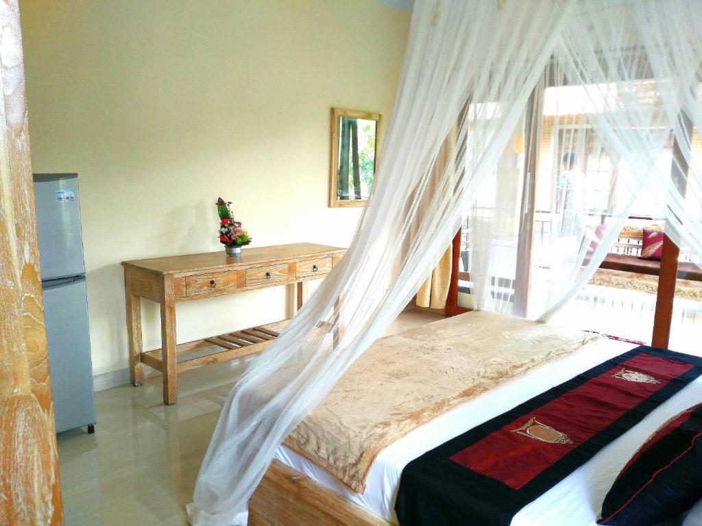 Postel nebo postele na pokoji v ubytování Qiul Guest House