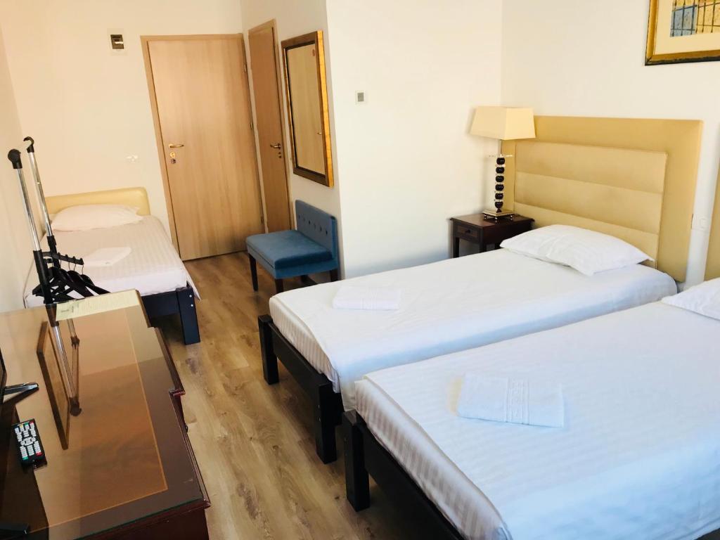 Postel nebo postele na pokoji v ubytování Hotel EKA