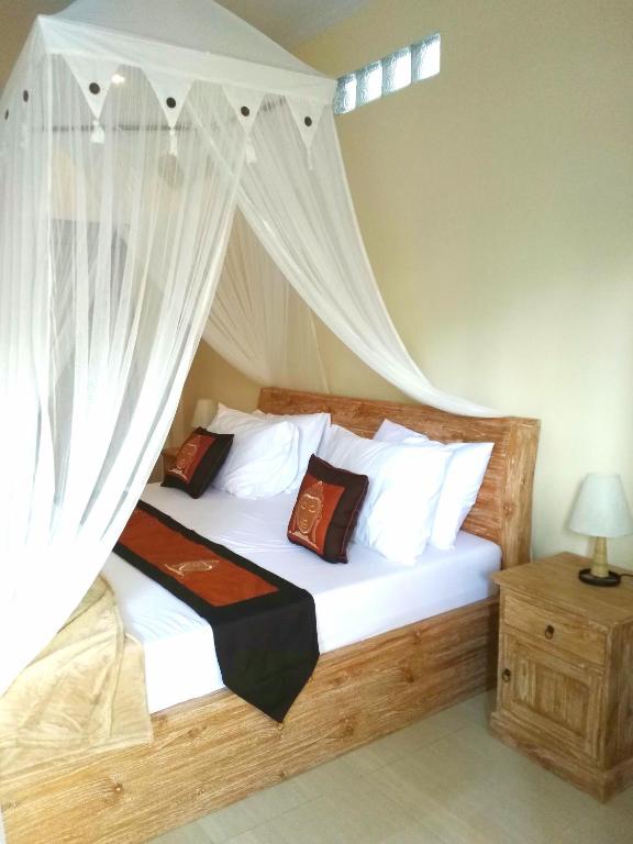 Postel nebo postele na pokoji v ubytování Qiul Guest House