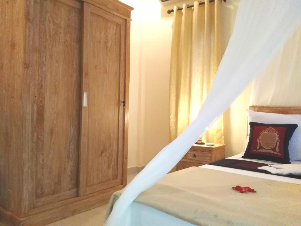 Postel nebo postele na pokoji v ubytování Qiul Guest House