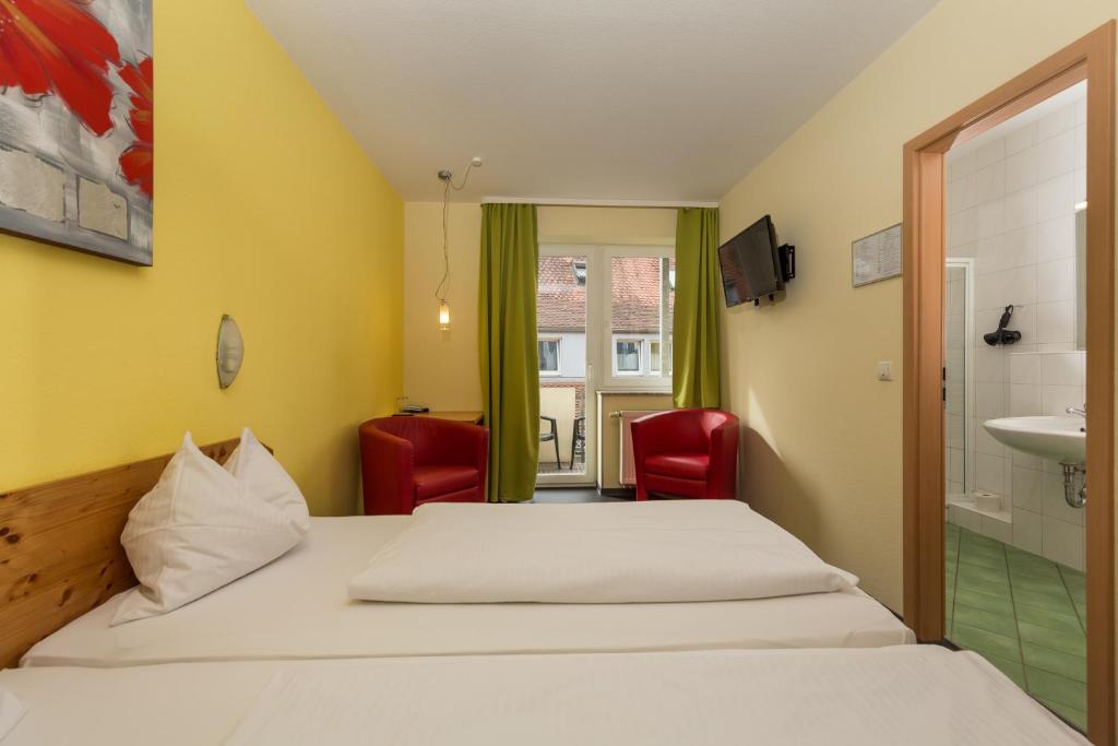 Postel nebo postele na pokoji v ubytování Hotel Demling