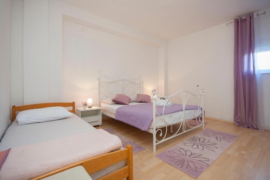 Postel nebo postele na pokoji v ubytování Rooms Katarina