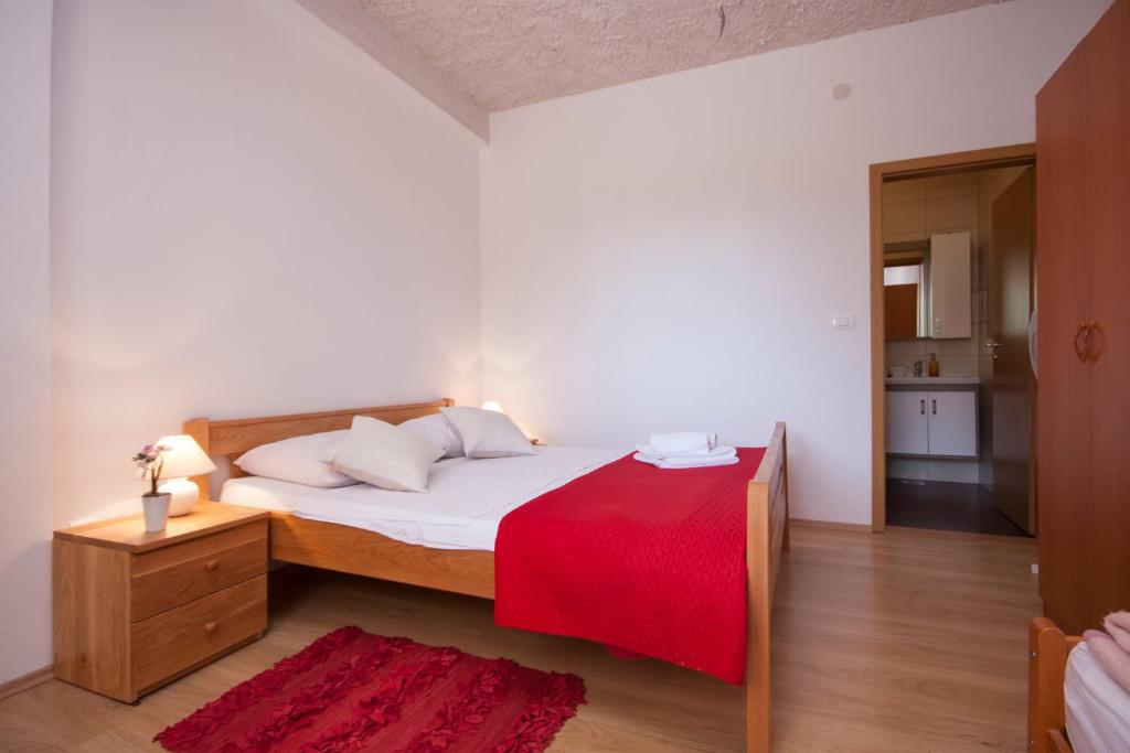 Postel nebo postele na pokoji v ubytování Rooms Katarina