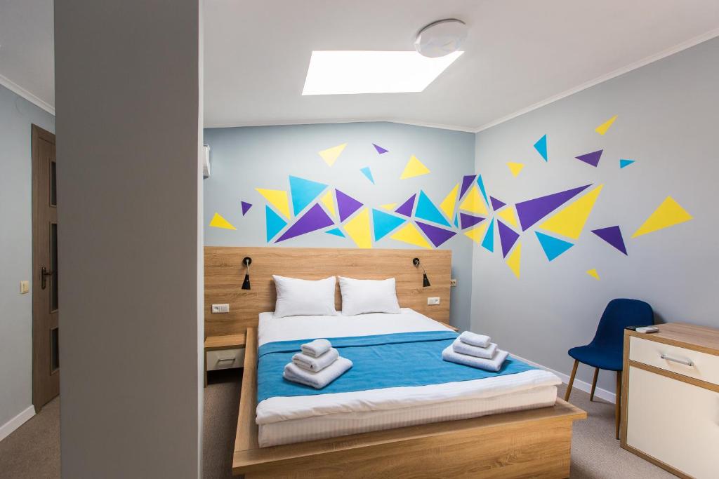 Ліжко або ліжка в номері Blum Hotel