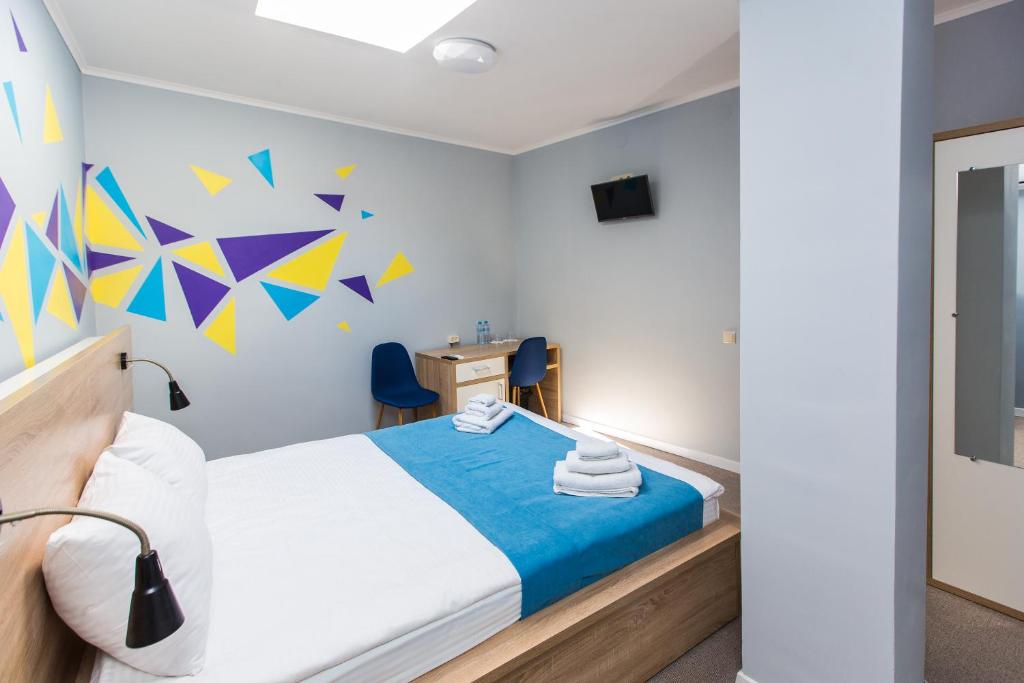 Ліжко або ліжка в номері Blum Hotel