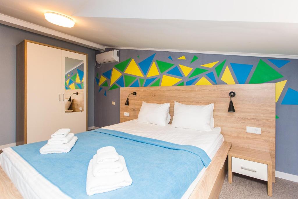 Ліжко або ліжка в номері Blum Hotel