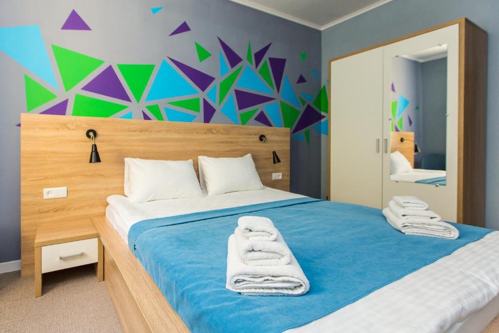 Ліжко або ліжка в номері Blum Hotel