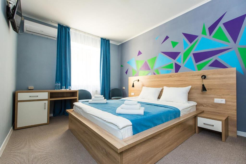 Ліжко або ліжка в номері Blum Hotel