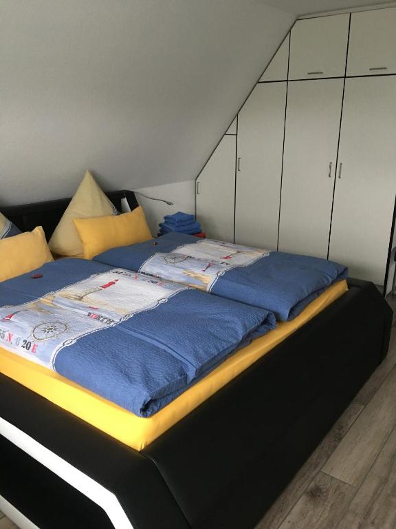 Postel nebo postele na pokoji v ubytování Haus Nordland