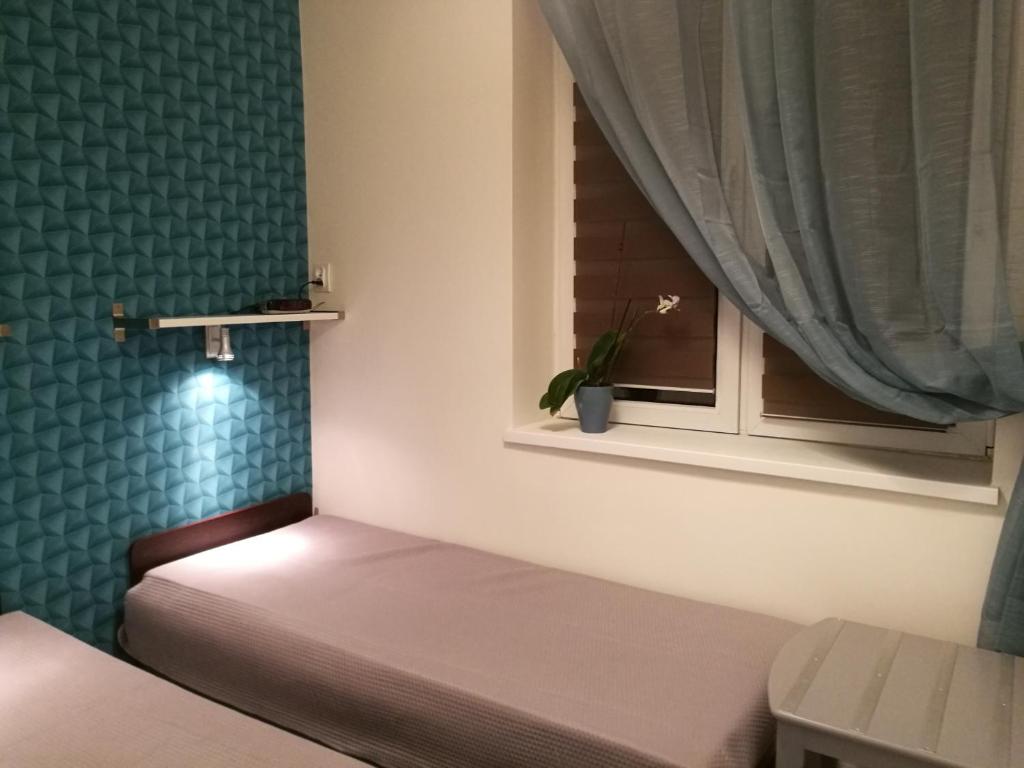 Posteľ alebo postele v izbe v ubytovaní Grand-Tourist Center Point Apartments