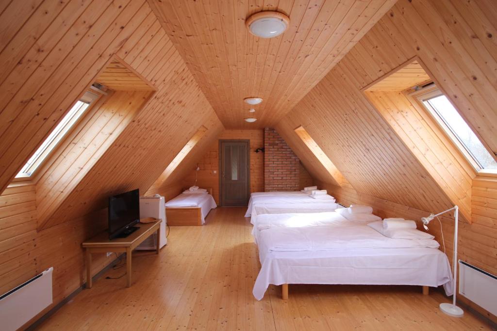 Un pat sau paturi într-o cameră la Ranna puhkemaja
