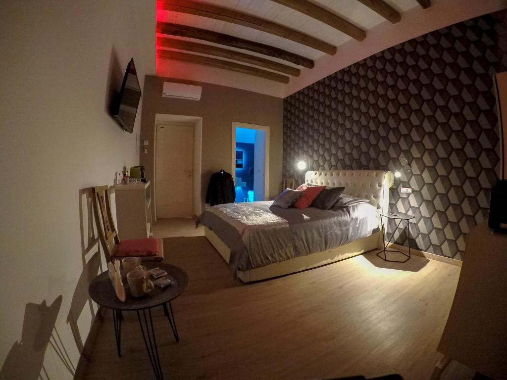 Posteľ alebo postele v izbe v ubytovaní MYO Cagliari Charming House