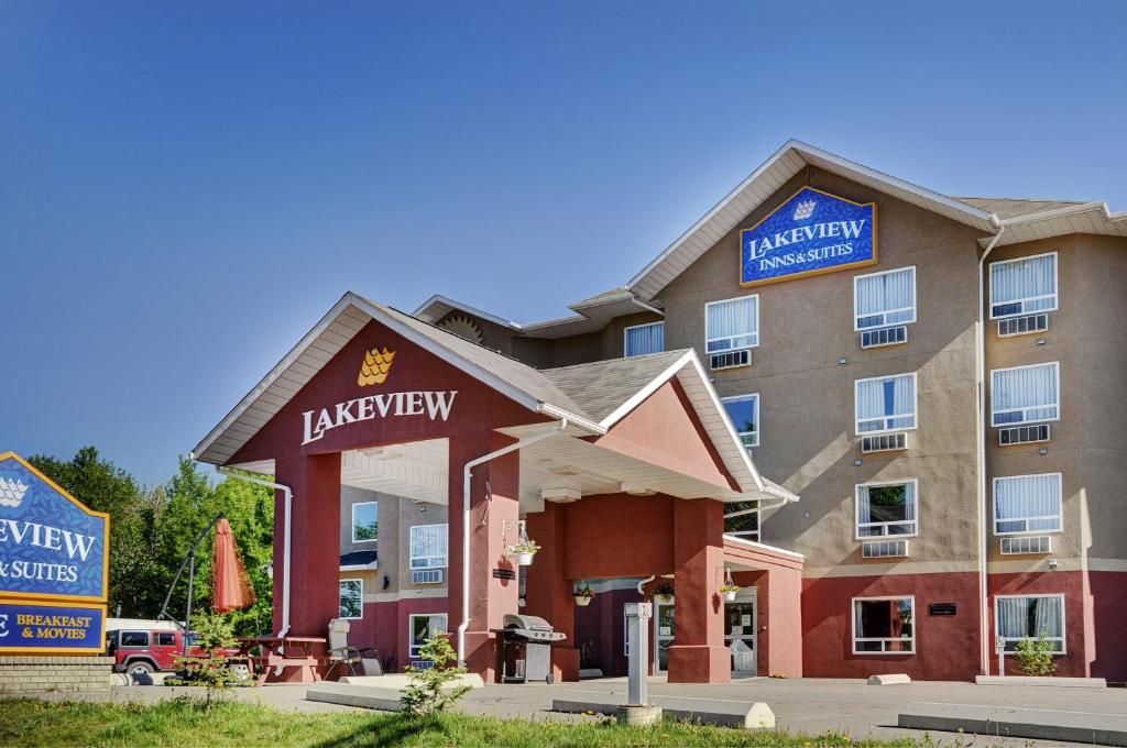 a hotel with a sign on the front of it at Lakeview Inns & Suites - Chetwynd in Chetwynd
