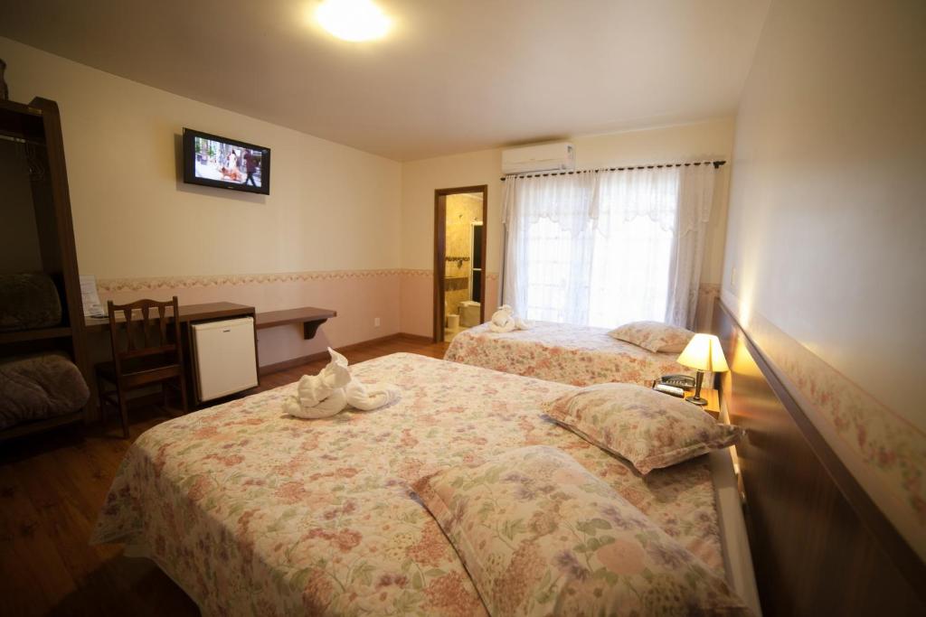 Postel nebo postele na pokoji v ubytování Pousada Vollweiter