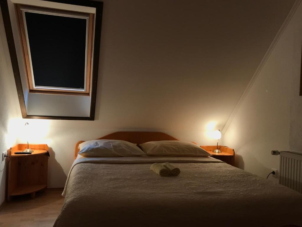 Posteľ alebo postele v izbe v ubytovaní Guest House Aurora