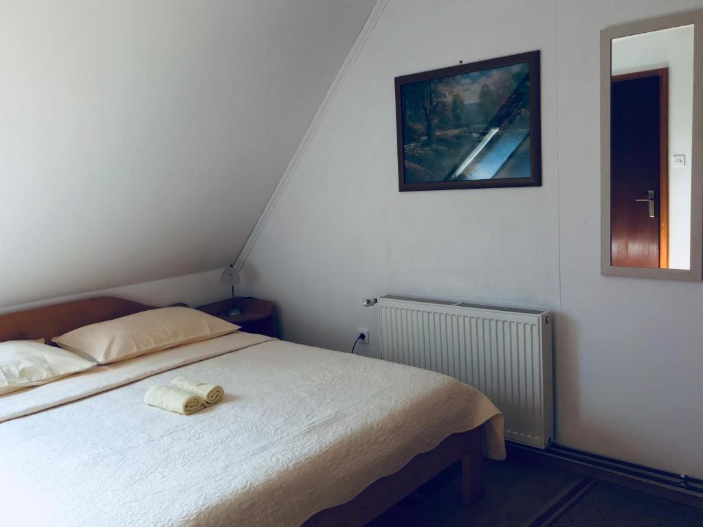 Posteľ alebo postele v izbe v ubytovaní Guest House Aurora