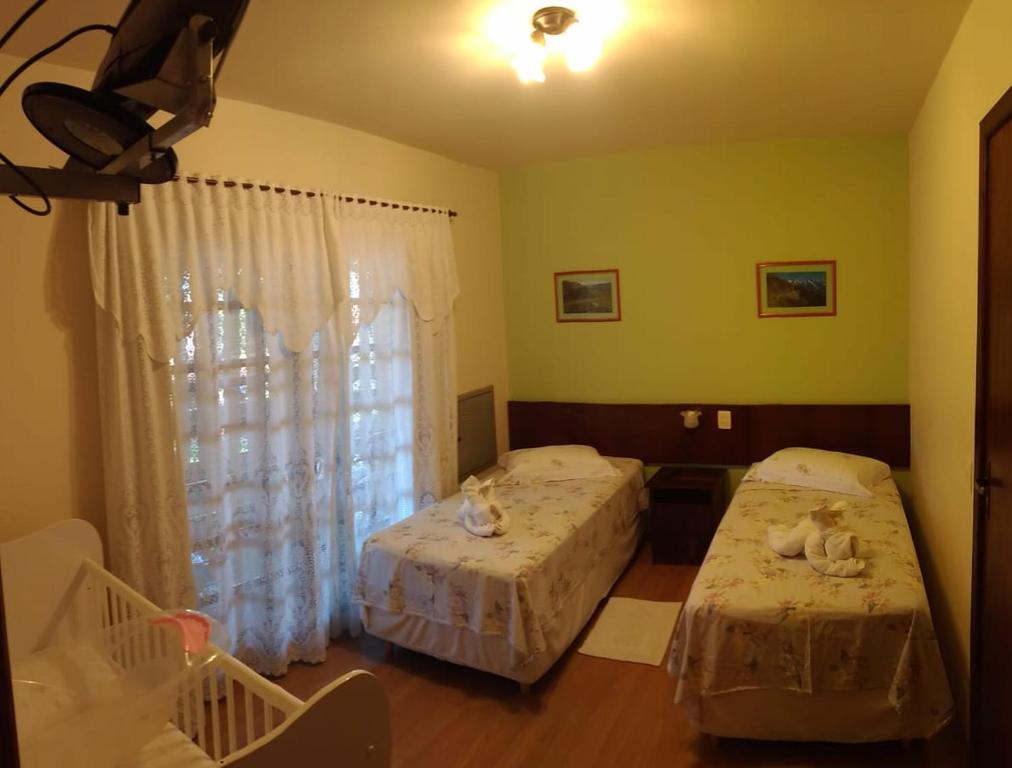 Postel nebo postele na pokoji v ubytování Pousada Vollweiter