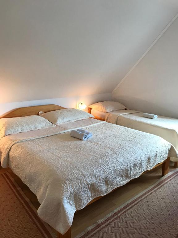 Posteľ alebo postele v izbe v ubytovaní Guest House Aurora