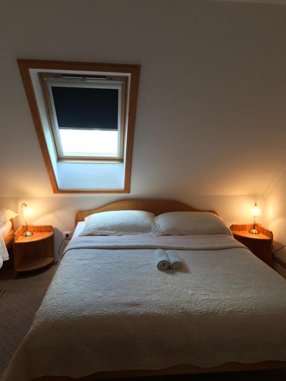 Posteľ alebo postele v izbe v ubytovaní Guest House Aurora