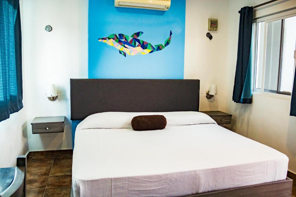 Postel nebo postele na pokoji v ubytování Hotel Tabasco Rio