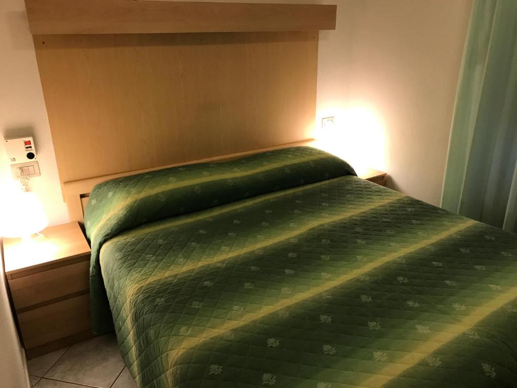Postel nebo postele na pokoji v ubytování Hotel B&B Rispescia Grosseto