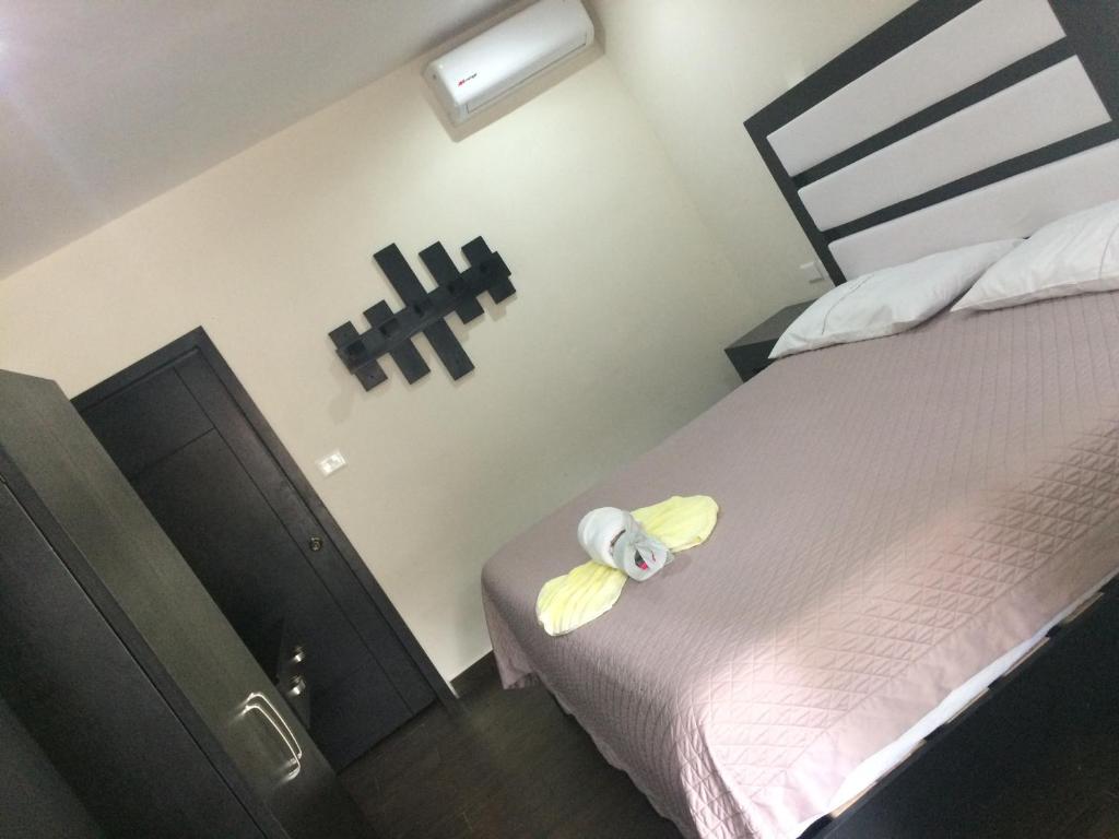 Postel nebo postele na pokoji v ubytování Hotel Sevilla Palenque