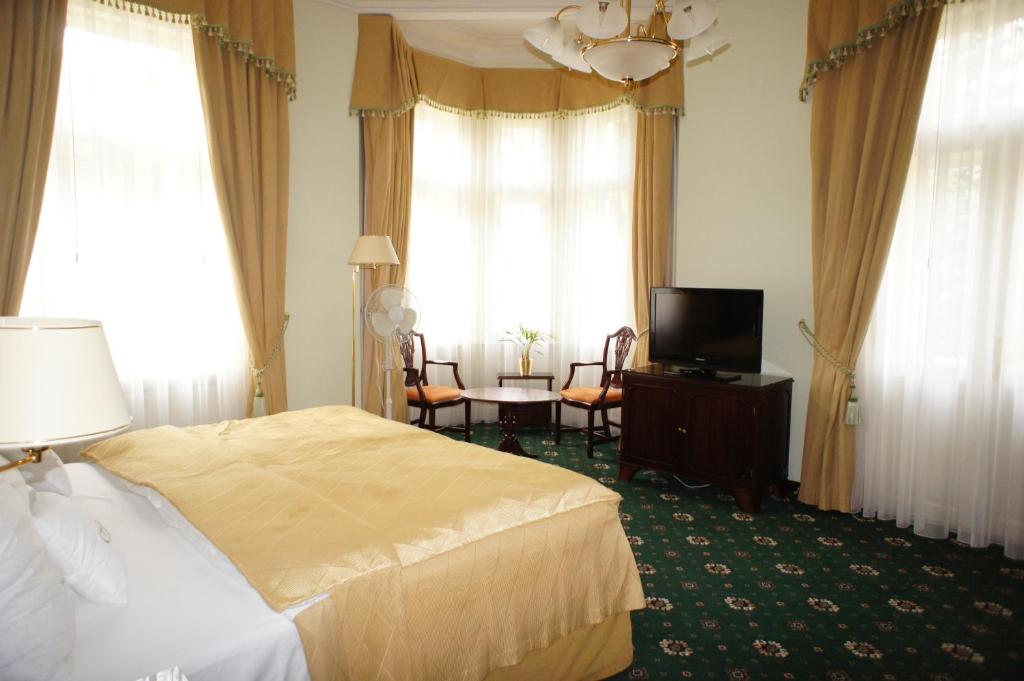 TV a/nebo společenská místnost v ubytování Hotel Mignon