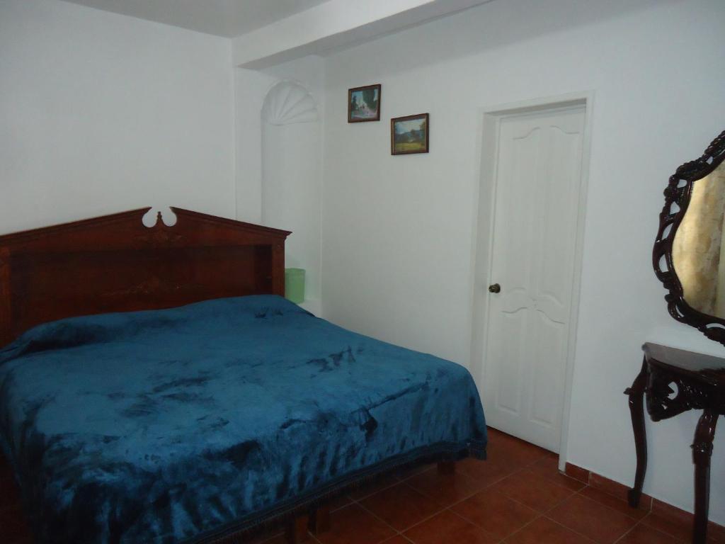 Postel nebo postele na pokoji v ubytování Hotel San Isidro