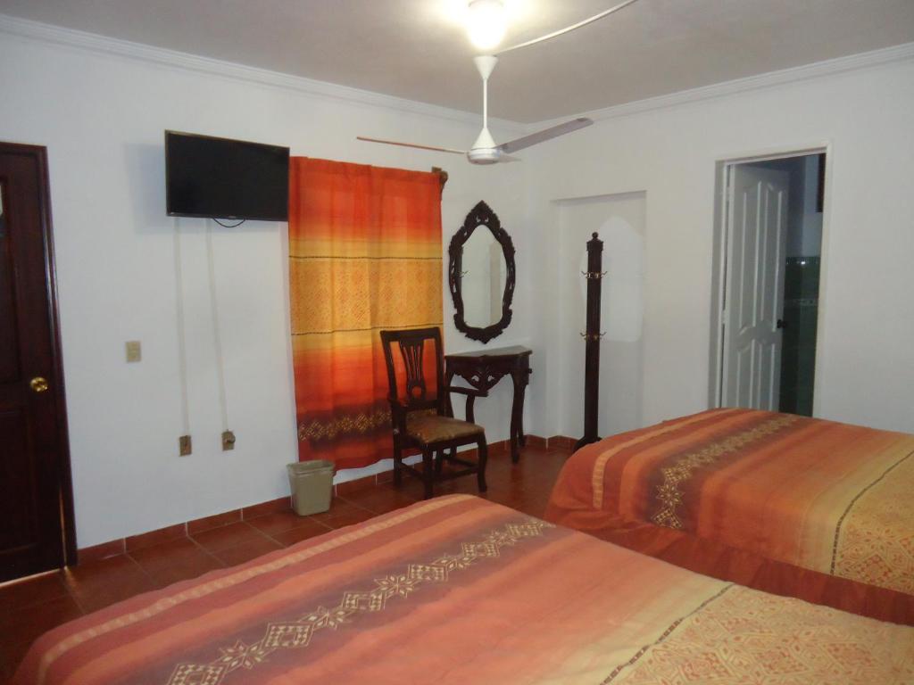 Postel nebo postele na pokoji v ubytování Hotel San Isidro