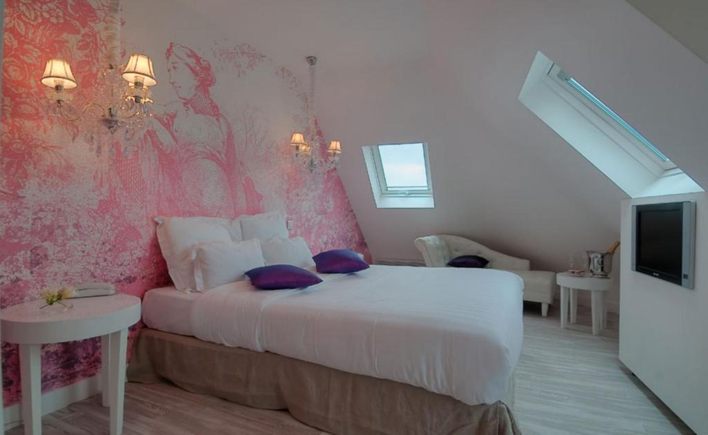 Poste&#x13E; alebo postele v izbe v ubytovan&iacute; Hotel Cluny Square