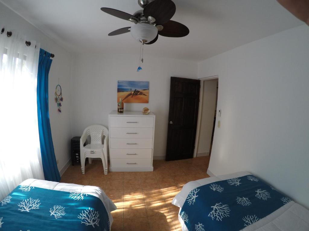 Postel nebo postele na pokoji v ubytování Coco Beach Home